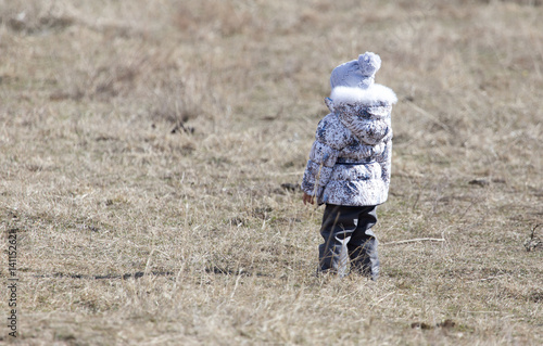 Little girl in a hooded jacket outdoors © schankz