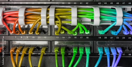 Obraz na płótnie Server rack with rainbow internet patch cord cables w salonie