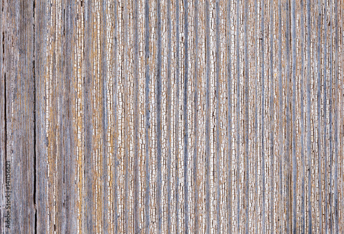 Old worn plank wall with upright white paint