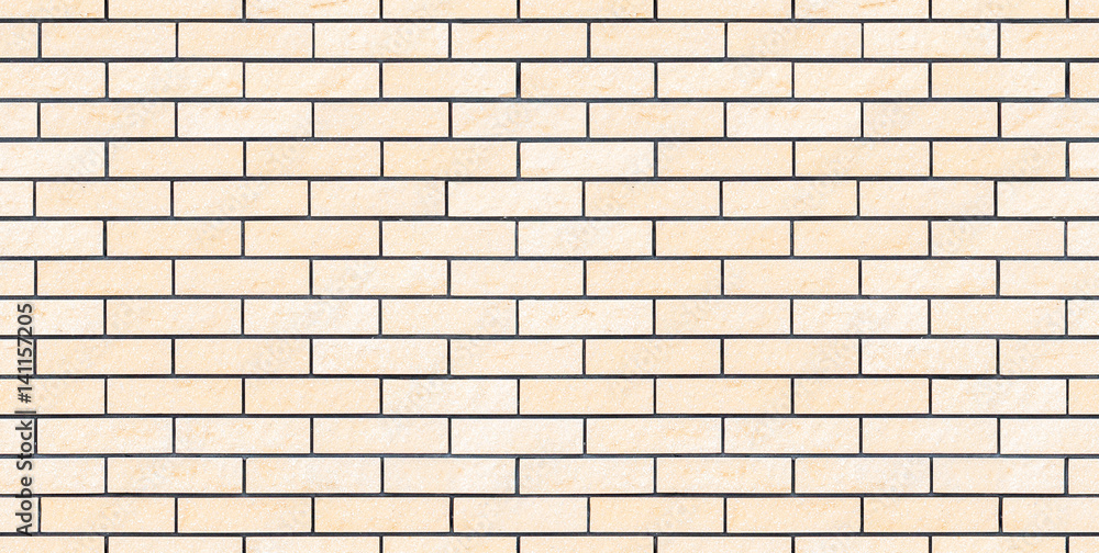 Seamless beige new and clean brick wall texture or background Seamless beige new and clean brick wall texture or background