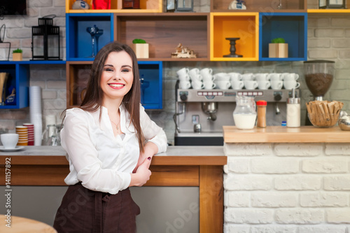 young girl preparing coffee in a cafe barista