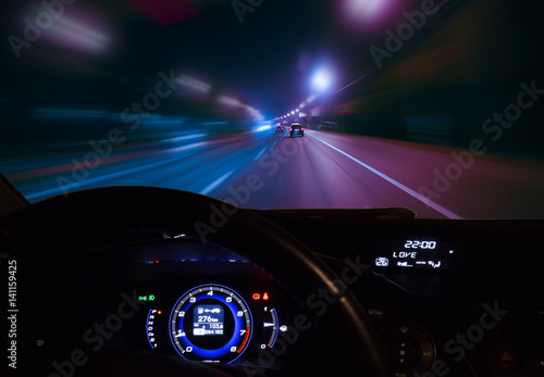 car moving on highway at night photo