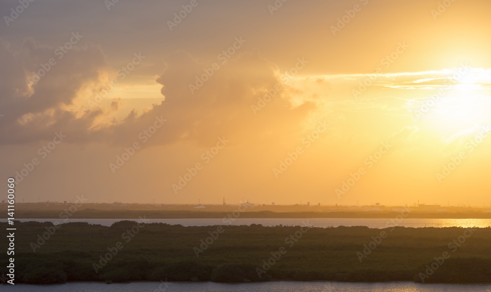 Yellow sky. Sunset over the Caribbean coast. Image taken from high level. Beautiful wallpaper.