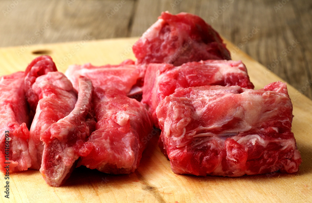 raw pork bones with meat, closeup, shallow depth of field