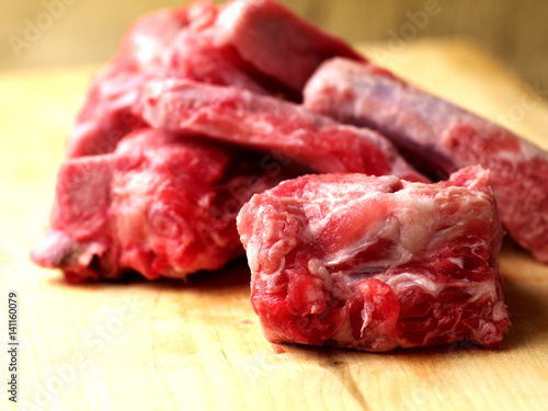 raw pork bones with meat, closeup, shallow depth of field