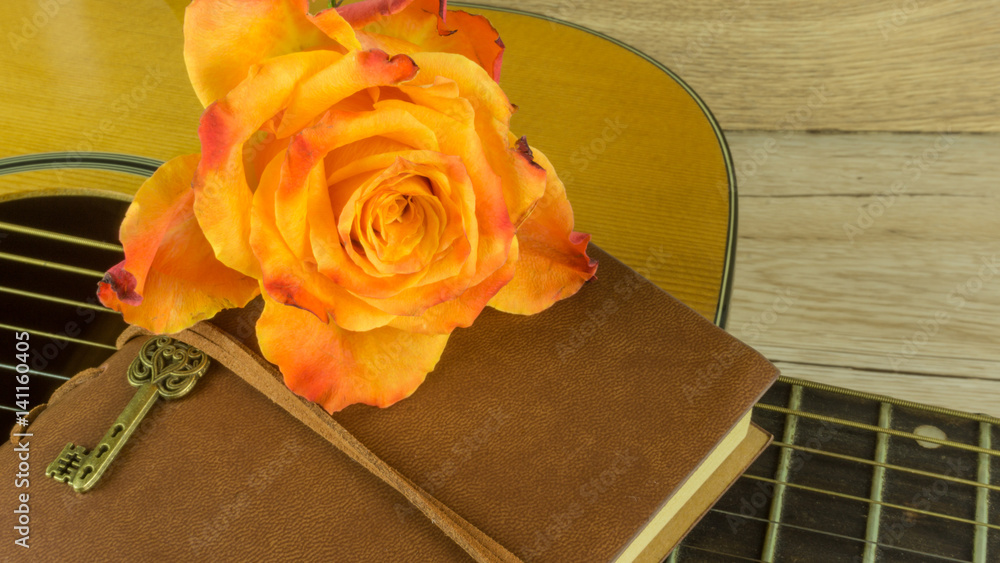 Guitar with a bouquet of roses as a background Stock-Foto | Adobe Stock