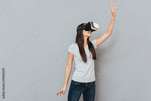 Young woman using virtual reality device