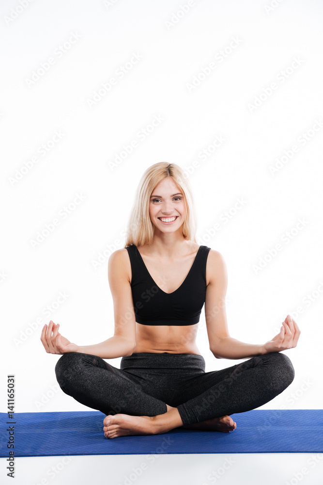 Fitness woman sitting make yoga exercises