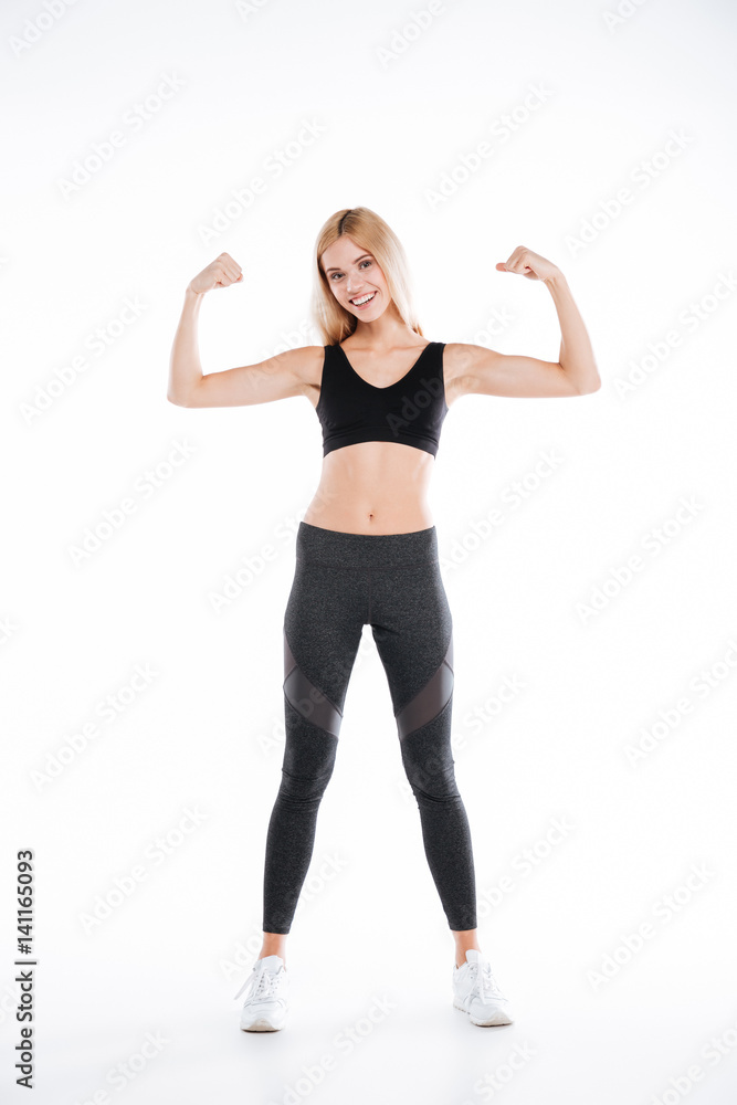 Pretty fitness lady showing her biceps. Pretty fitness lady showing her biceps.
