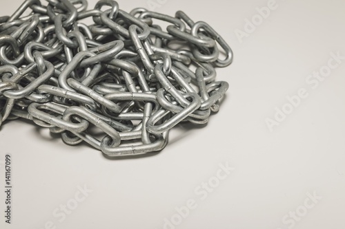 Steel chain heap - abstract metal background. Macro shot.