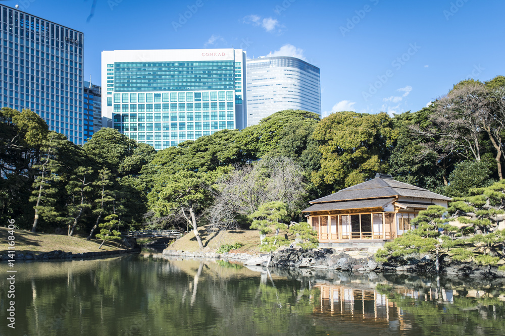 Old and modern architecture. 30 December 2016 Photo taken at the Hamarikyu Gardens, a public park in Tokyo, Japan. Located at the mouth of the Sumida River, it was opened April 1, 1946.