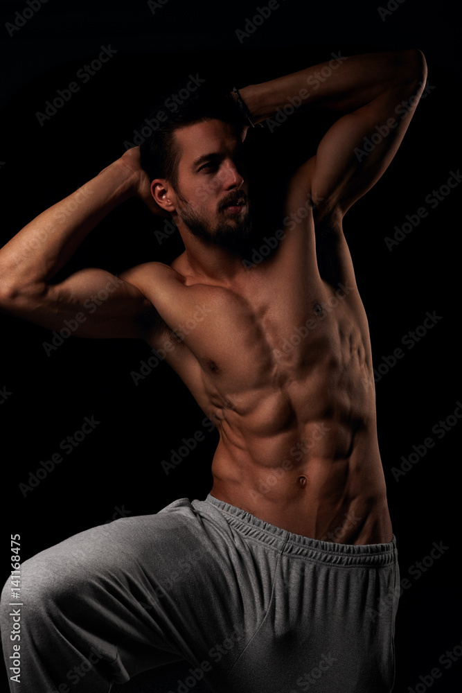 Fitness male model showing his muscular torso