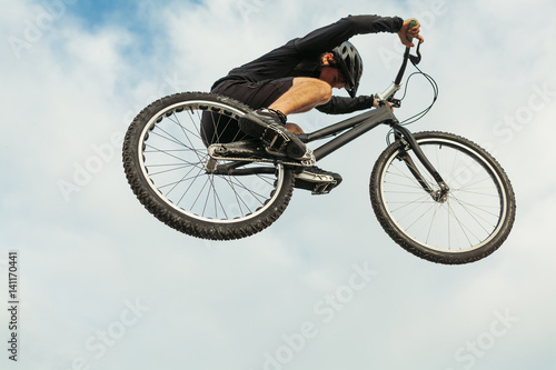 Man jumping on a bike