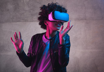 A girl playing with VR headset