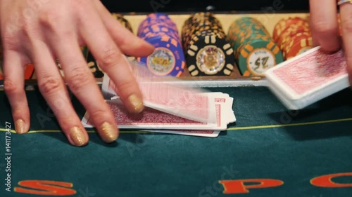 Casino: Dealer shuffles the poker cards.