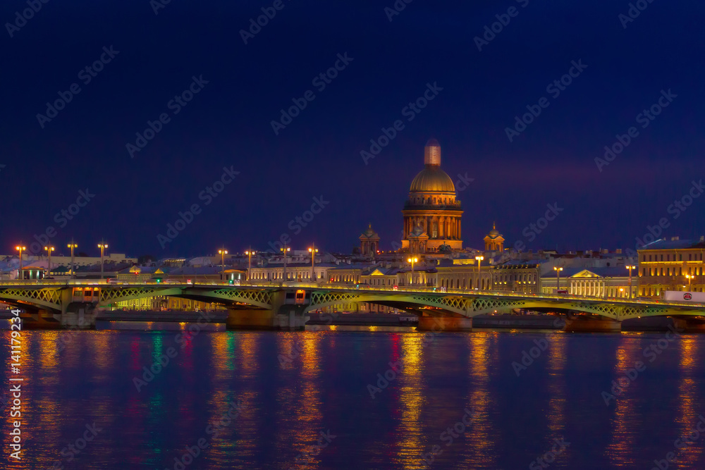 Evening city. Embankment of St. Petersburg. Saint Isaac's Cathedral.
