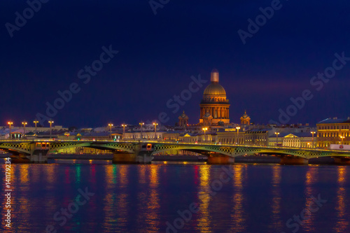 Evening city. Embankment of St. Petersburg. Saint Isaac's Cathedral.