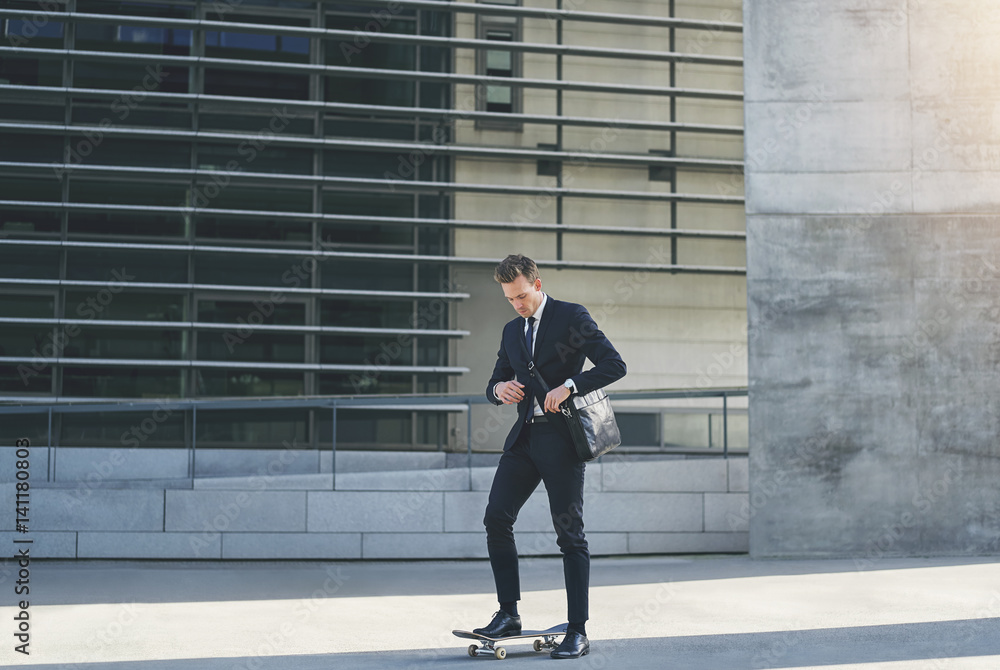 Man in suit adjusting his shoulder bag Man in suit adjusting his shoulder bag