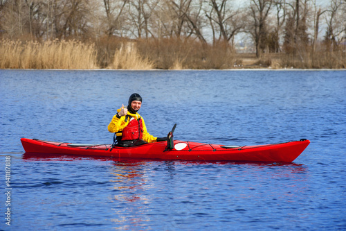 man kayaking on the red kayak on the river 15