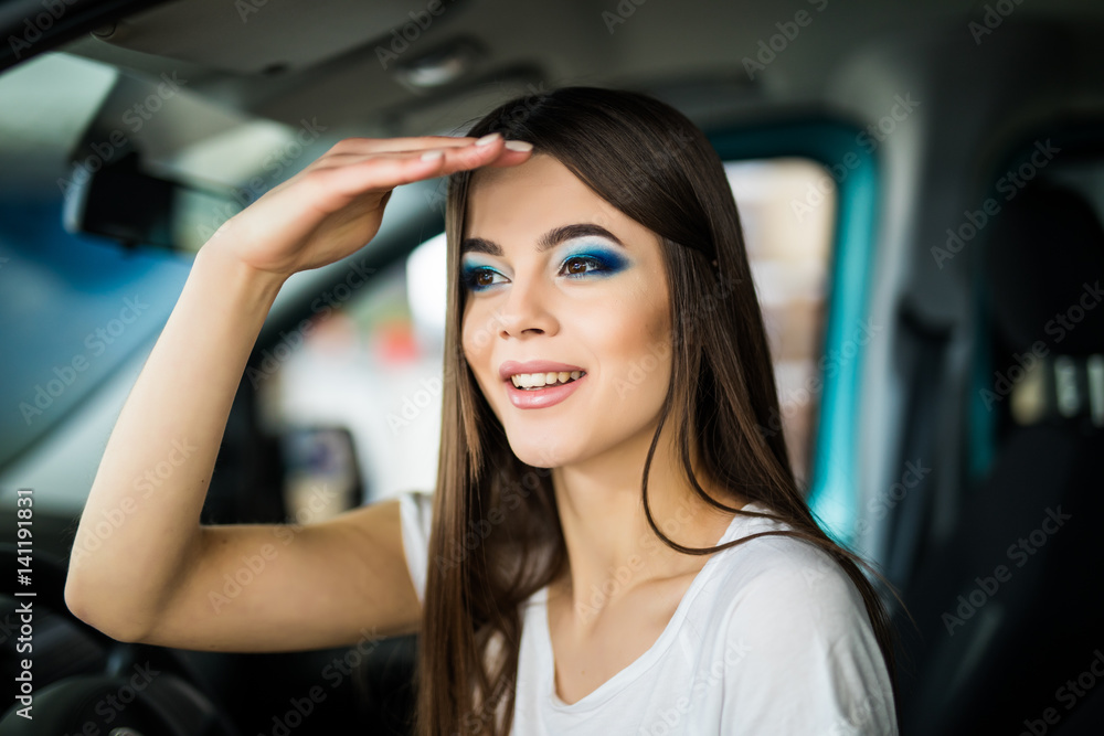 Young woman gesturing while seat in car. looking for. Young woman gesturing while seat in car. looking for.