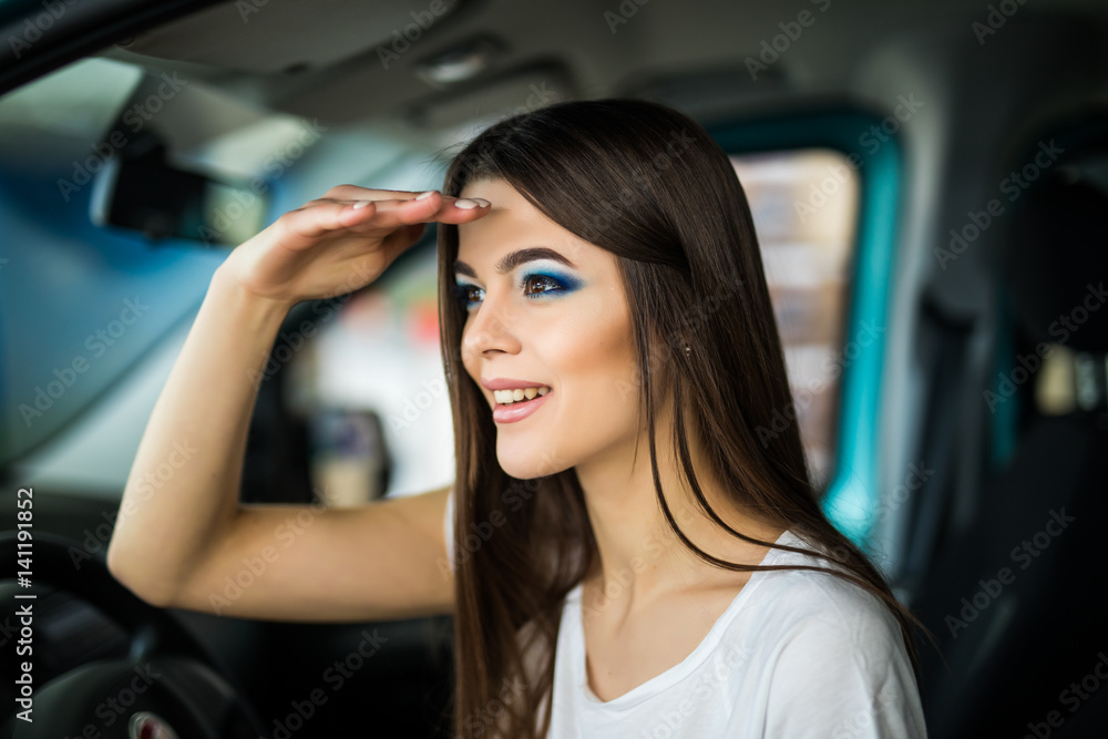 Young woman gesturing while seat in car. looking for. Young woman gesturing while seat in car. looking for.