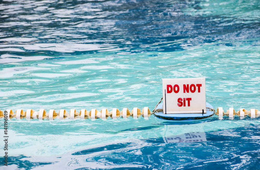 Swimming pool and depth warning sign