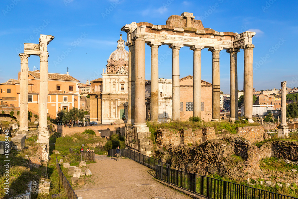 Rome, Italy. Roman Forum: on the left - the ruins of the Temple of Vespasian and Titus (79 AD), on the right - the ruins of the temple of Saturn (489 BC - 283 AD)
