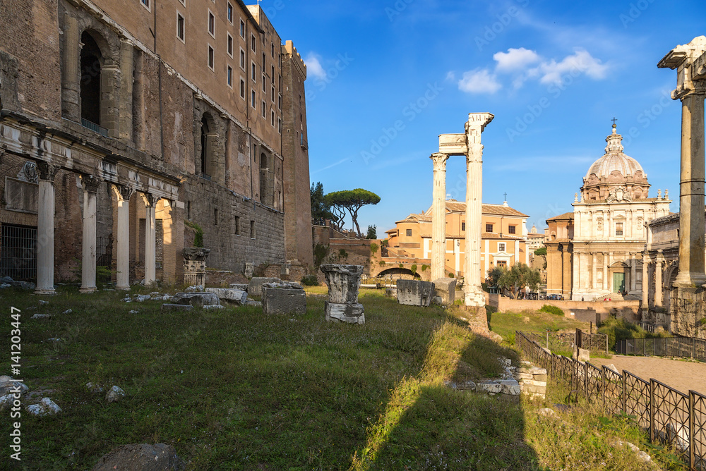 Rome, Italy. Roman Forum, from left to right: Portico of Twelve Gods, Tabularia (Palace of Senators), Temple of Vespasian, in the background Mamertinum (Church of San Pietro in Carzere)