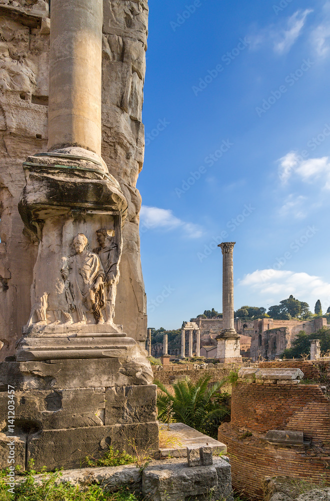 Rome, Italy. Roman Forum: relief on the arch of Septimius Severus (203). In the background, Foki's column and Palatine Hill. Rome, Italy. Roman Forum: relief on the arch of Septimius Severus (203). In the background, Foki's column and Palatine Hill.