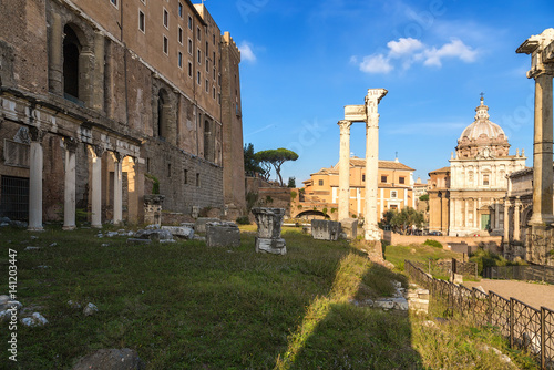 Rome, Italy. Roman Forum, from left to right: Portico of Twelve Gods, Tabularia (Palace of Senators), Temple of Vespasian, in the background Mamertinum (Church of San Pietro in Carzere)