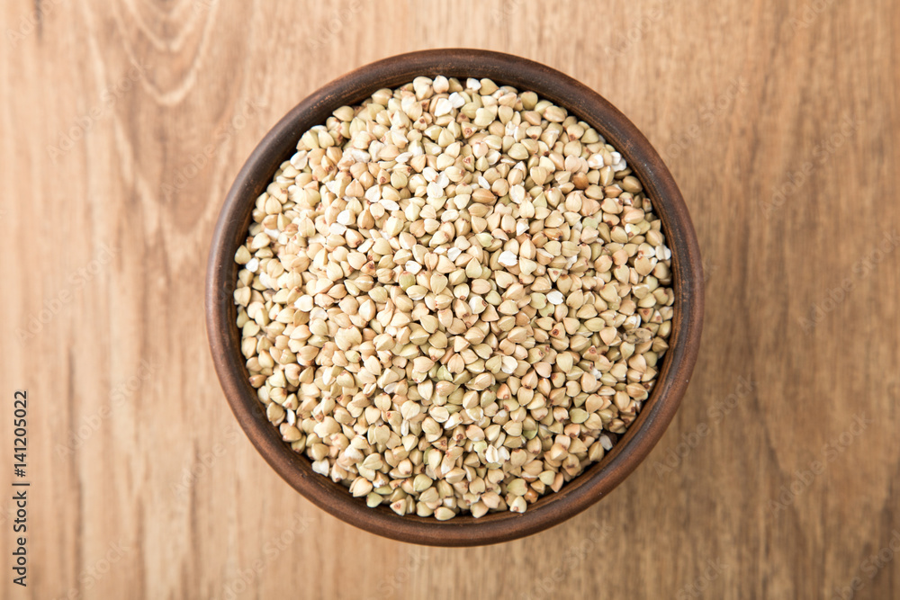 green buckwheat on wooden table. Healthy diet concept food green buckwheat on wooden table. Healthy diet concept food