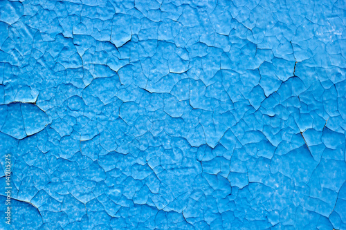 the texture of the old cracked blue paint on concrete wall