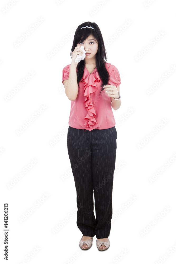 Sad businesswoman crying in studio Sad businesswoman crying in studio