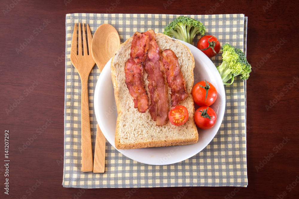 breakfast with bread and bacon in white dish breakfast with bread and bacon in white dish