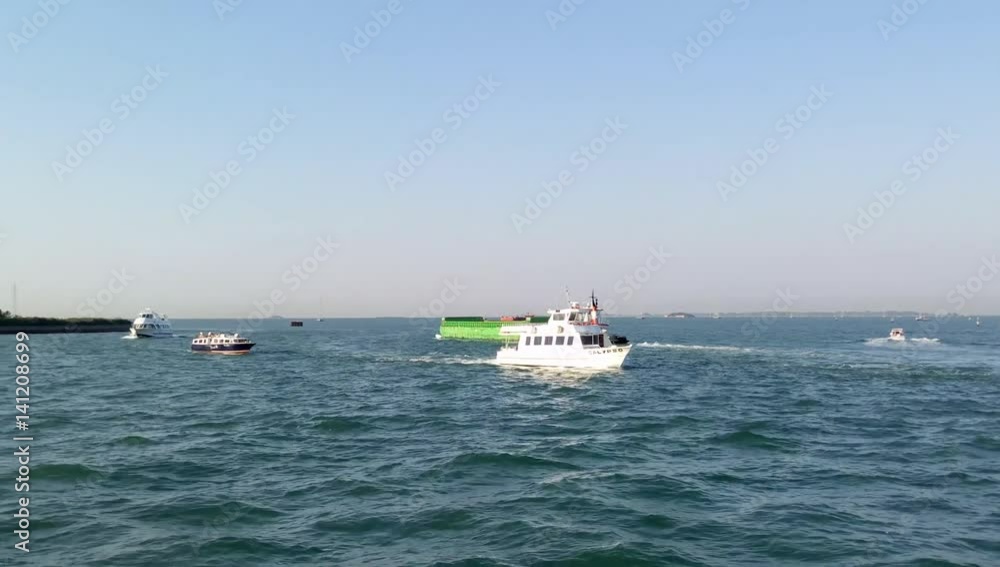 Water taxi floating from the Tronchetto parking to the San Marco square Water taxi floating from the Tronchetto parking to the San Marco square