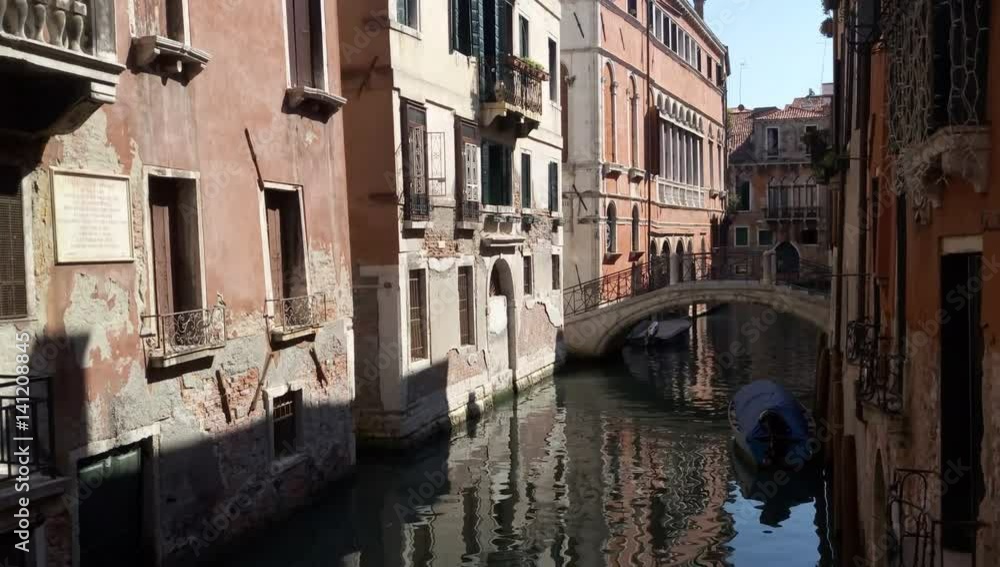 Small narrow canal in the city Small narrow canal in the city