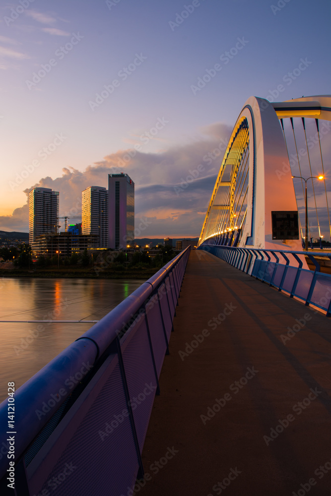 Obraz premium View of the bridge and center city at sunset Bratislava Slovakia eastern Europe