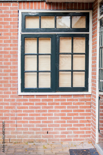 photo of beautiful cool windows with jalousie on one of buildings © Masson