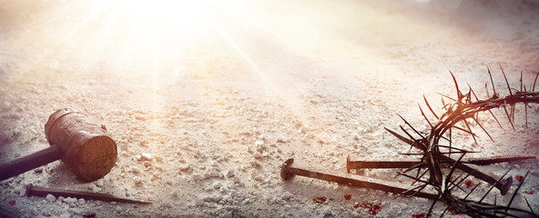 Passion Of Jesus Christ - Hammer and Bloody Nails And Crown Of Thorns On Arid Ground
