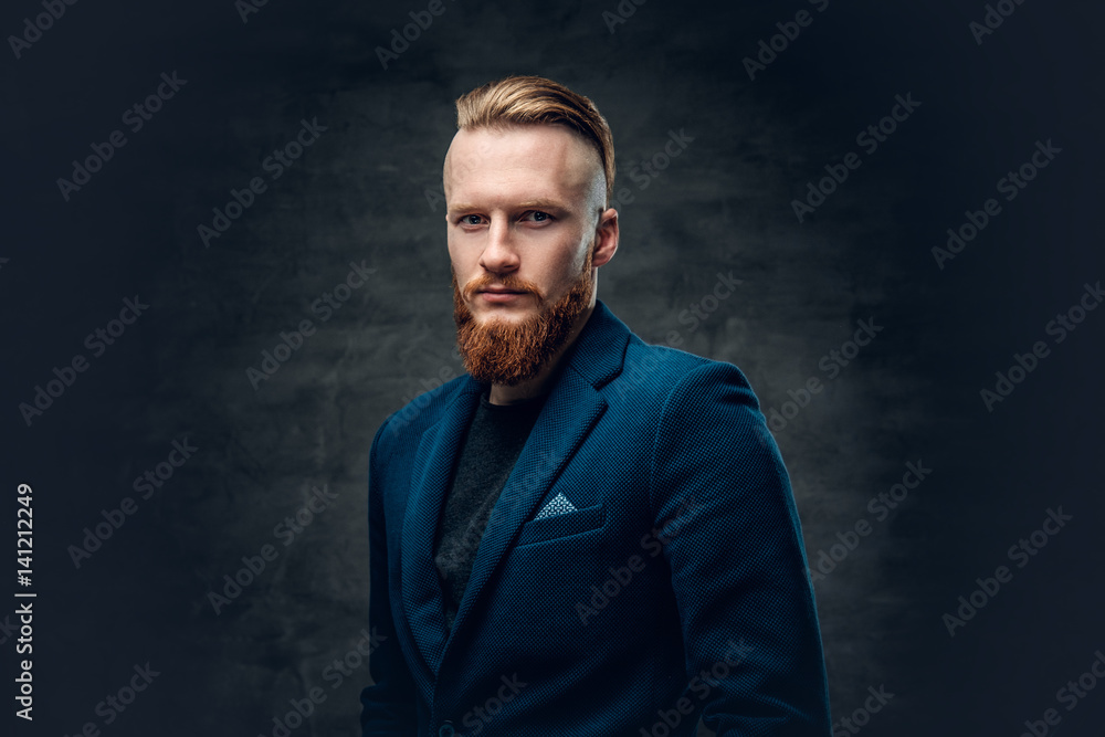 Redhead bearded hipster male dressed in a blue jacket. Redhead bearded hipster male dressed in a blue jacket.