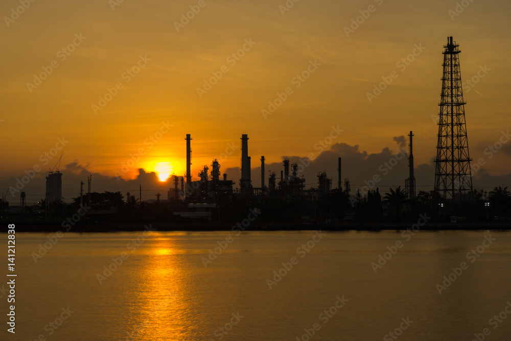 Silhouette sunrise scence of Oil Refinery factory industry