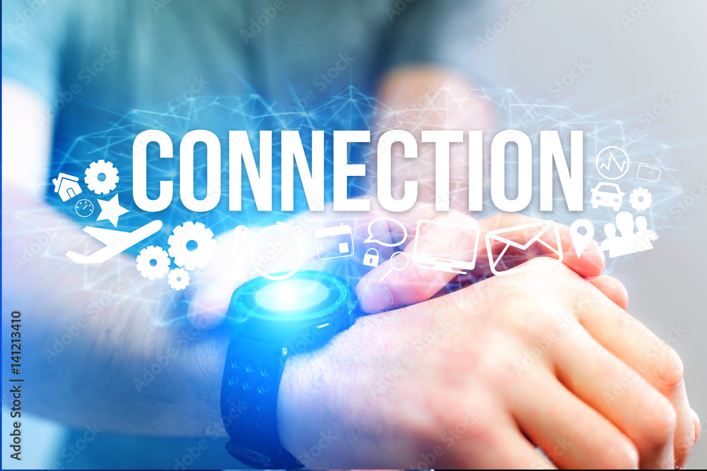 Concept of man holding a futuristic interface with connection title and multimedia icons flying all around - Internet concept Concept of man holding a futuristic interface with connection title and multimedia icons flying all around - Internet concept