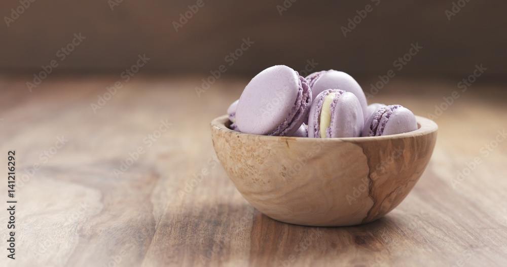 bowl with lavender violet macarons on table, 4k photo