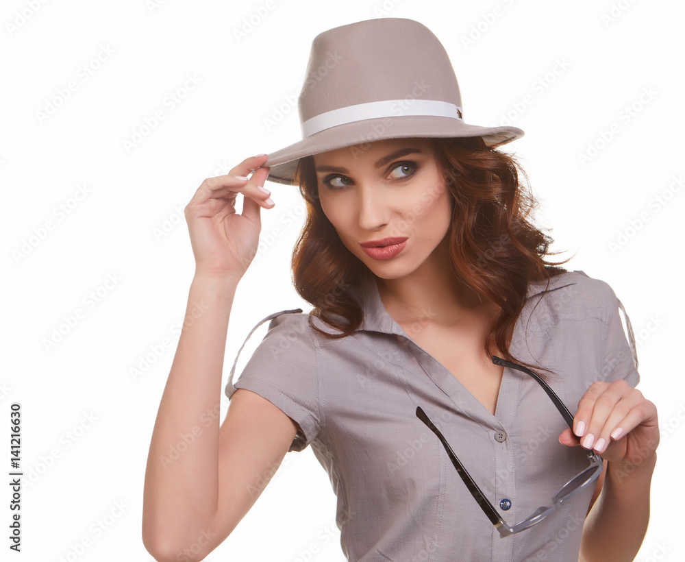 Young Woman with spring hat against yellow background Young Woman with spring hat against yellow background