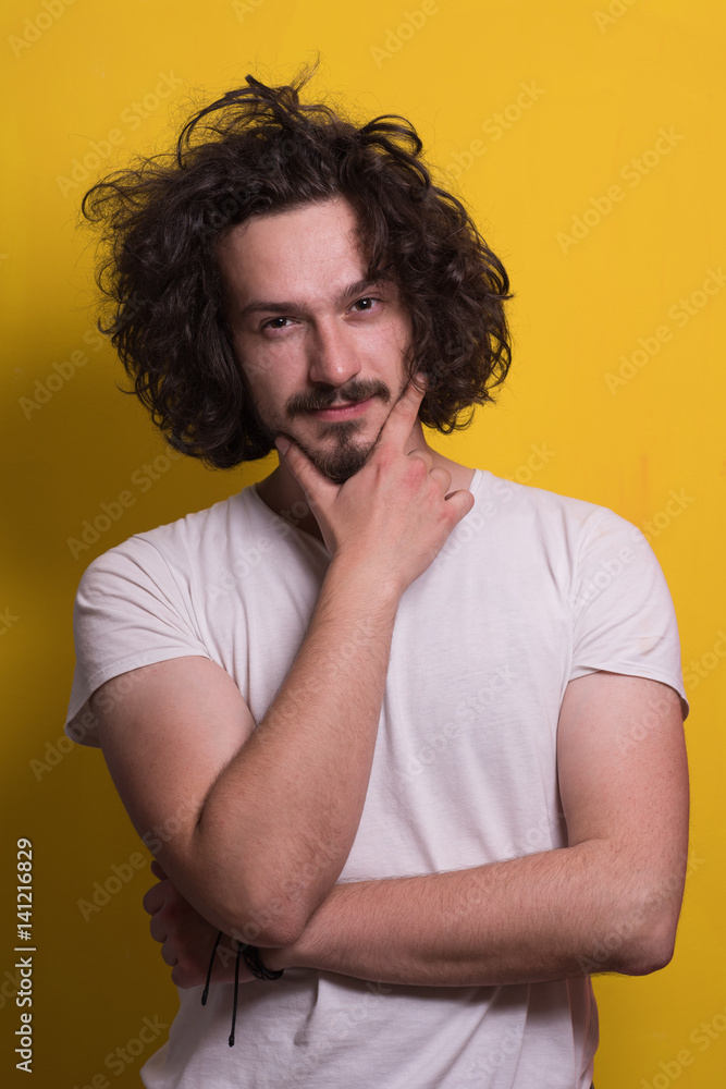 young man with funny hair over color background young man with funny hair over color background