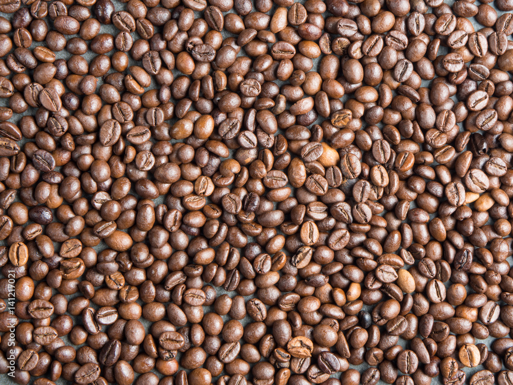 Roasted coffee beans background , captured from top view with sharp focus Roasted coffee beans background , captured from top view with sharp focus