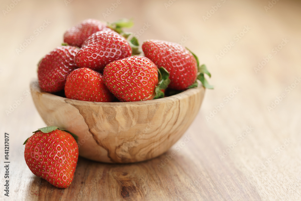 fresh strawberries in bowl on wood table with copy space, organic garden berries fresh strawberries in bowl on wood table with copy space, organic garden berries