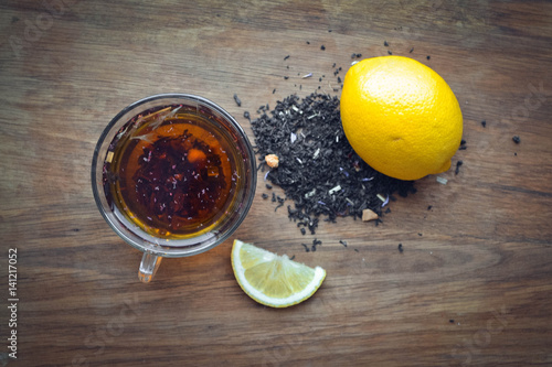 Top view of a cup hot tea lime slice.