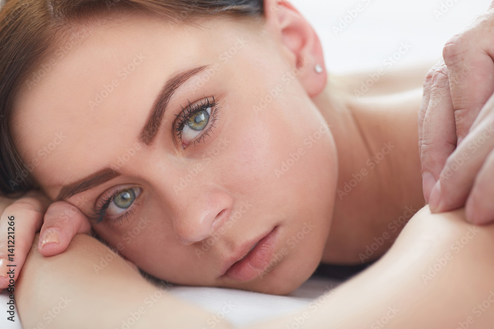 Beautiful woman receiving a relaxing back massage at spa. Beautiful woman receiving a relaxing back massage at spa.