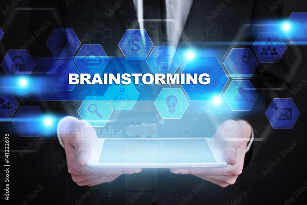 Businessman holding tablet PC with brainstorming concept. Businessman holding tablet PC with brainstorming concept.
